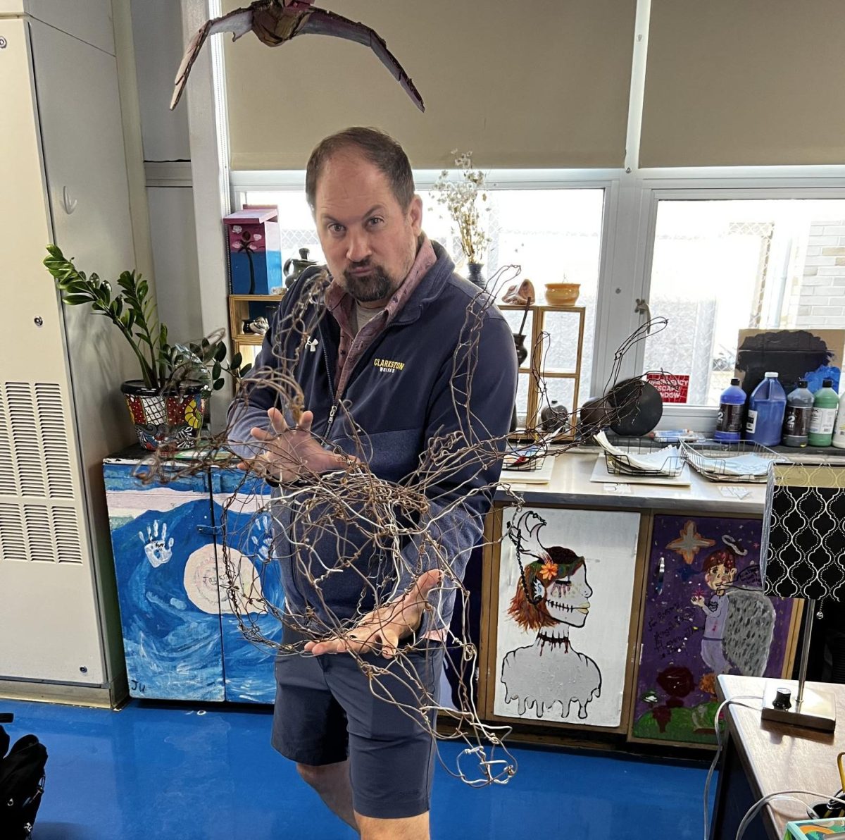 Mr. Breen displays his handcrafted wire moose.