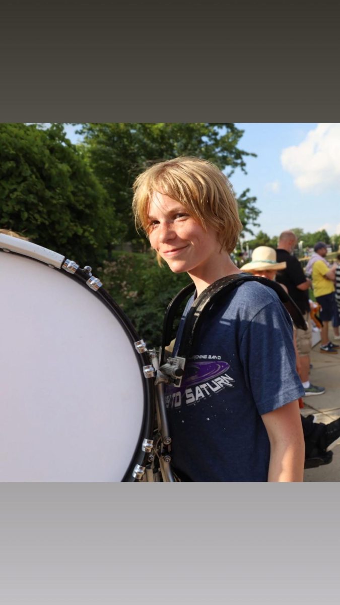 Vincent Gilbert with his drum in marching band practice.