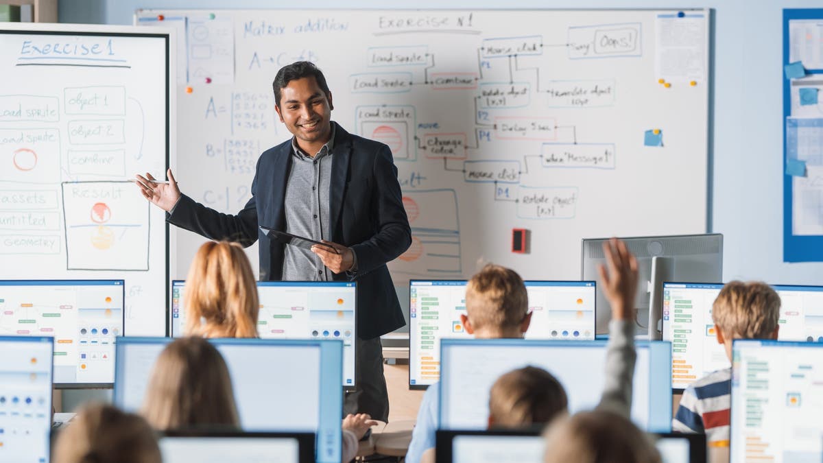 Teacher teaching their class with technology.