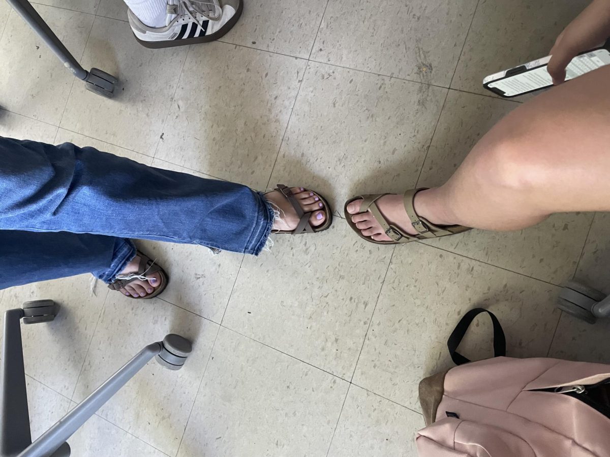 Students and teachers participating in Toes Out Tuesday.
